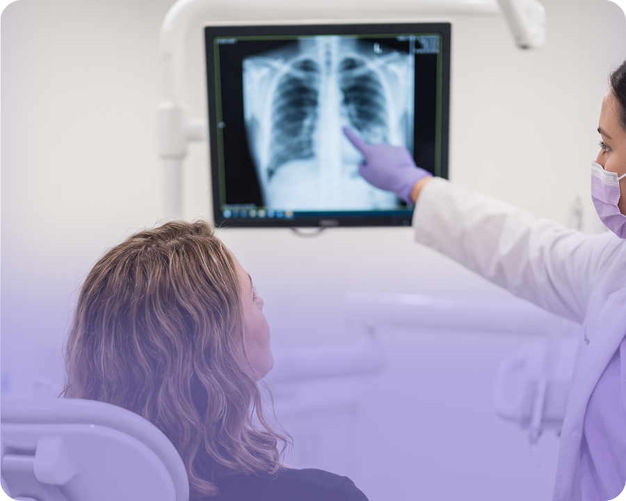 Healthcare worker reviewing X-ray